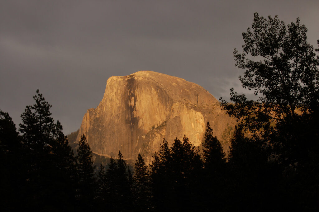 Half Dome at sunset in Yosemite Valley, Yosemite National Park. NPS / Damon Joyce. Public domain.